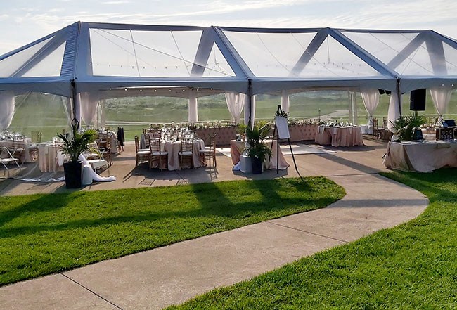 Tent with clear panels, set up for event